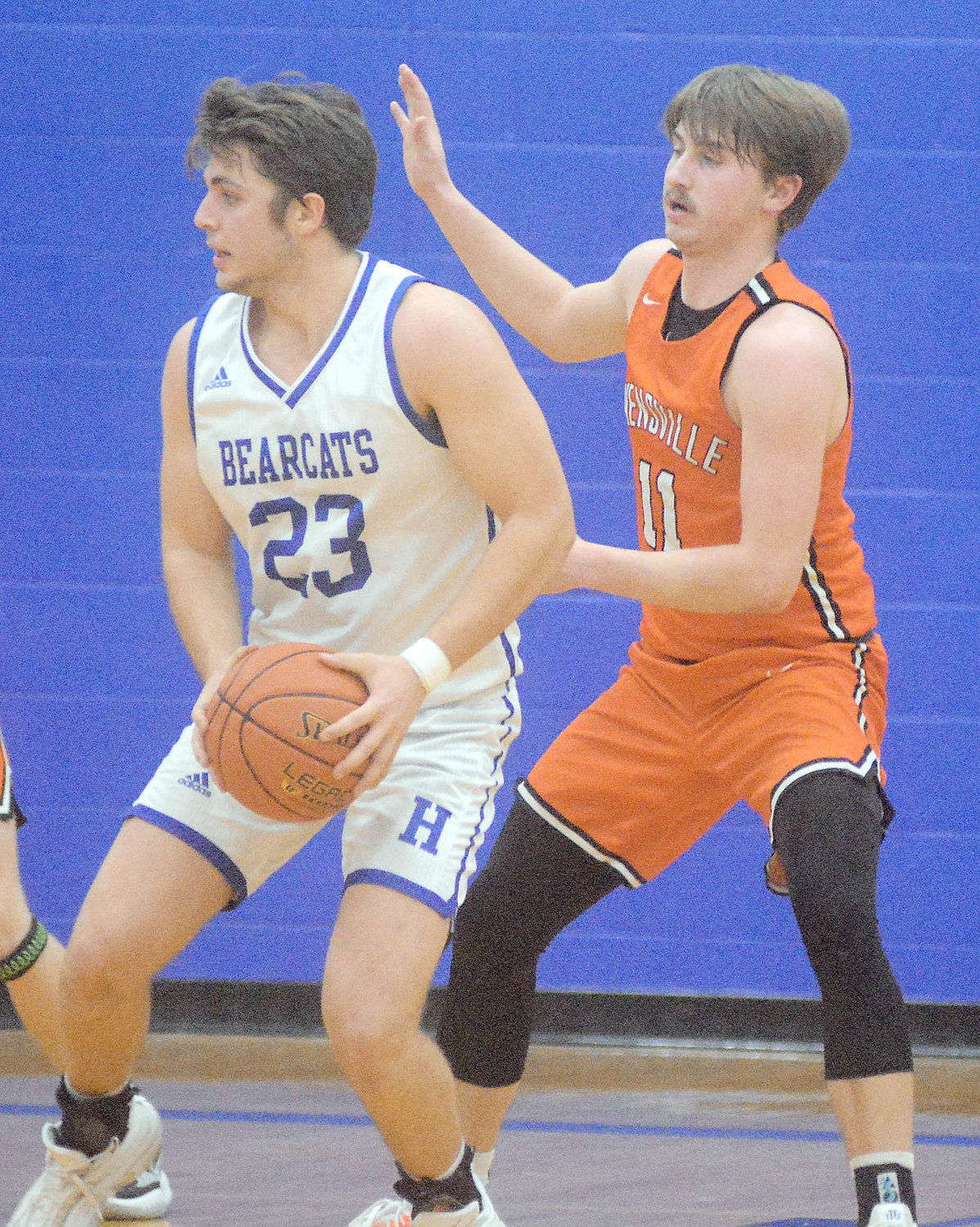 Bryce Payne (right) applies defensive pressure to Hermann’s Parker Anderson during their FRC hardwood showdown in northern Gasconade County. All four players earned All-FRC basketball honors.